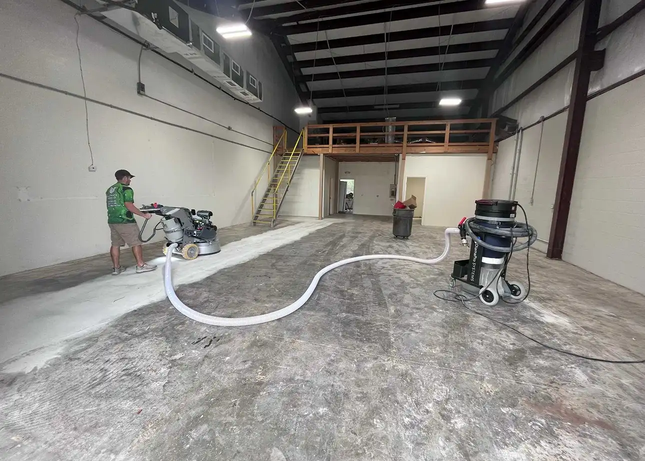 Technician applying high-quality concrete sealant in Lee County, FL