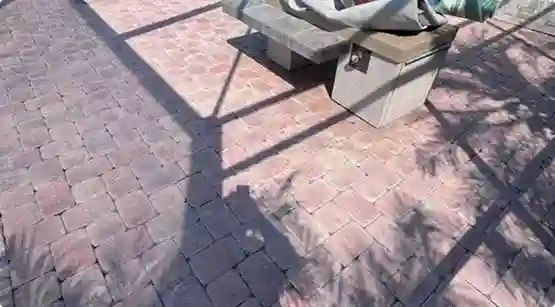 Stained and unprotected concrete surface before sealing treatment in Lee County, Florida