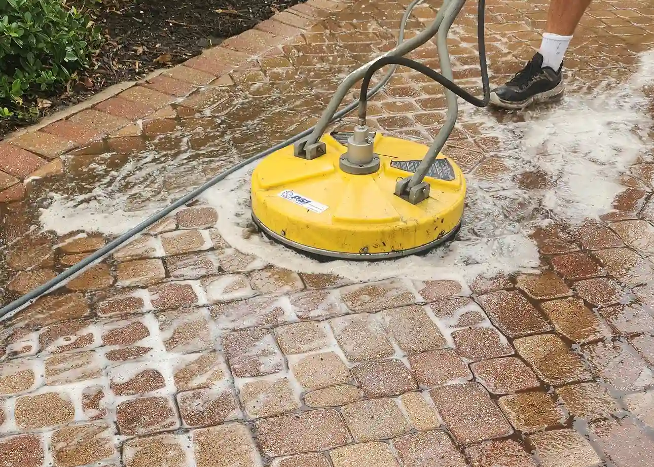 Surface Shield expert applying joint sand between pavers for long-lasting stability