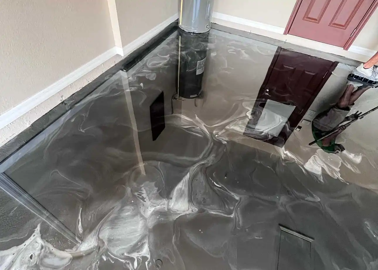 Epoxy floor installation in a residential garage in Sarasota County by Surface Shield