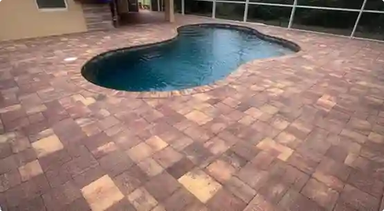 Restored and vibrant paver driveway after professional sealing by Surface Shield in Charlotte County, Florida