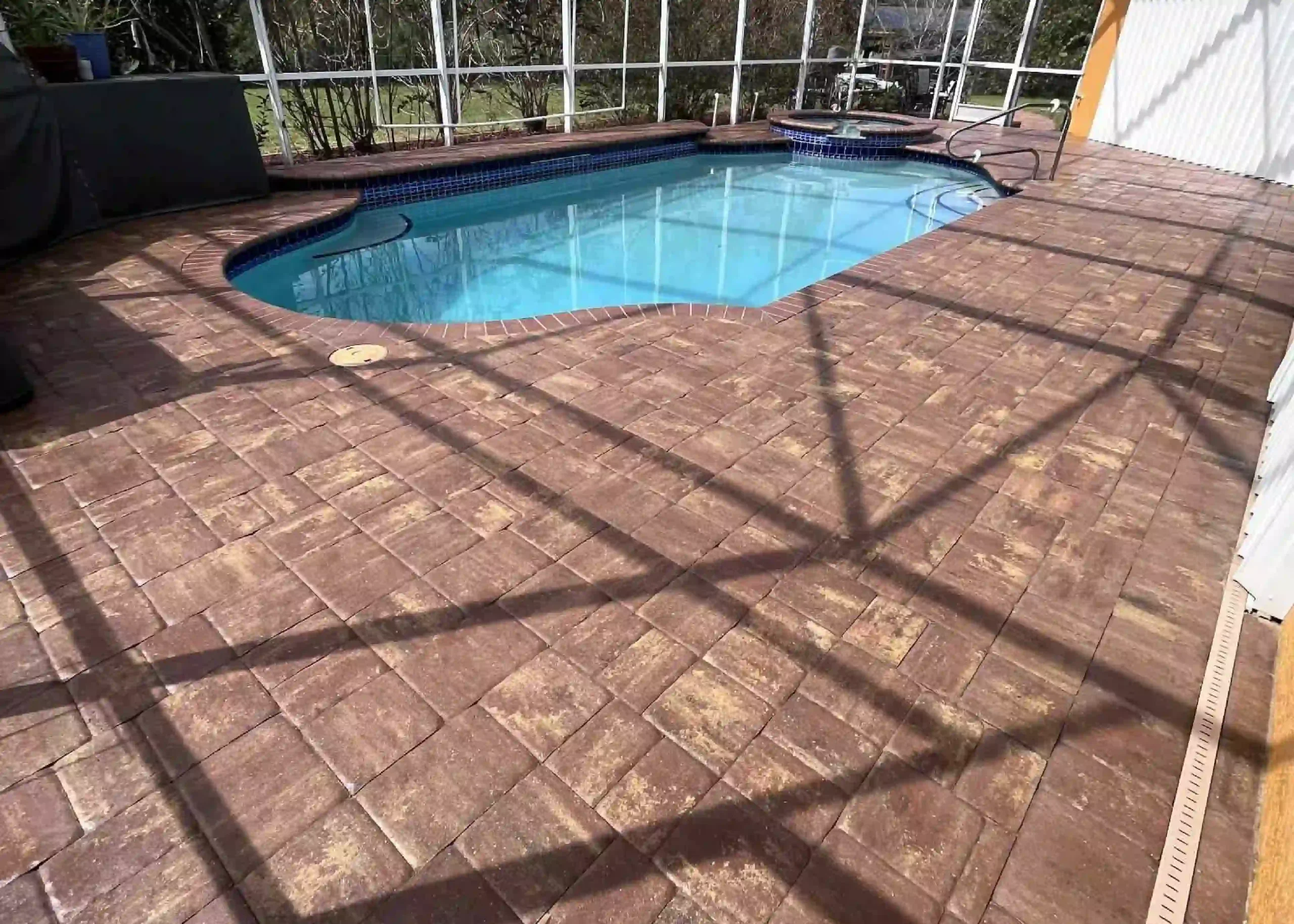 Freshly sealed paver surface with enhanced color and protection after professional sealing in Charlotte County, Florida